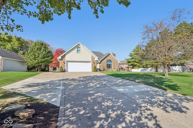 view of front of property with a front lawn and a garage