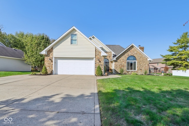 view of front of home with a garage and a front yard