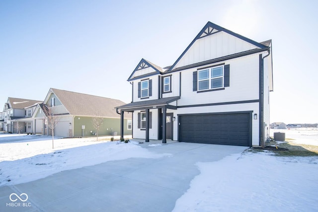 view of front of house featuring central AC unit and a garage