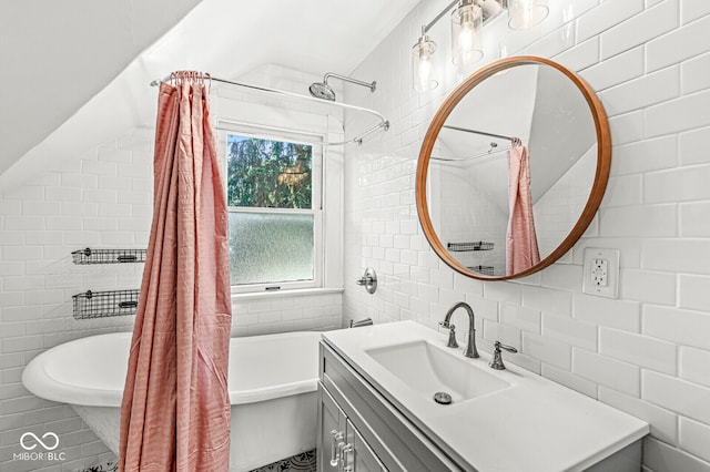 bathroom featuring backsplash, vanity, tile walls, and shower / tub combo