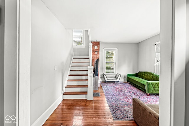 stairs featuring hardwood / wood-style flooring