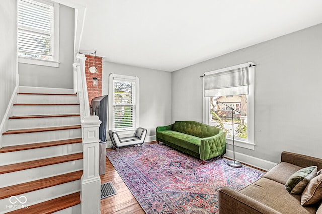 living room featuring hardwood / wood-style floors and a healthy amount of sunlight