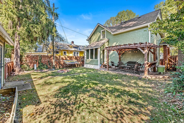 back of house with a patio, a pergola, and a yard