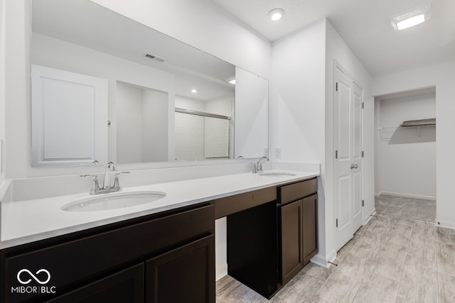 bathroom with vanity and walk in shower