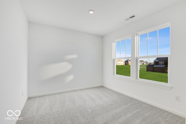 empty room with carpet flooring