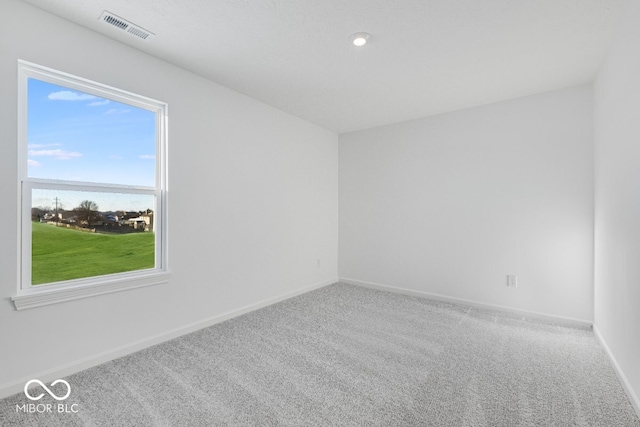 empty room with carpet flooring