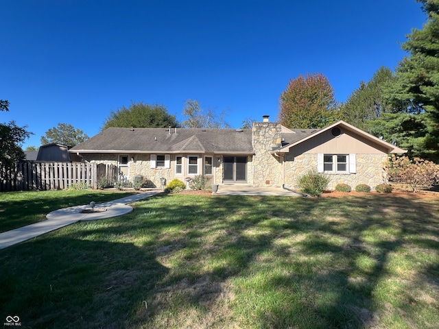 back of house featuring a yard and a patio