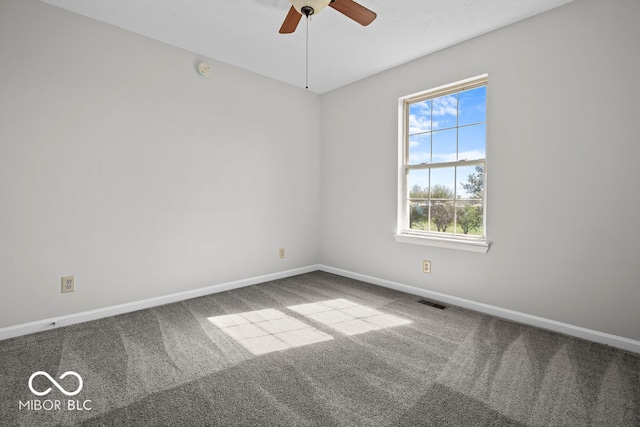 carpeted empty room featuring ceiling fan