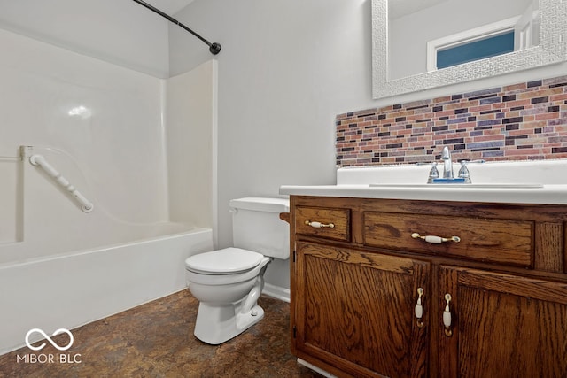 full bathroom with  shower combination, vanity, toilet, and tasteful backsplash