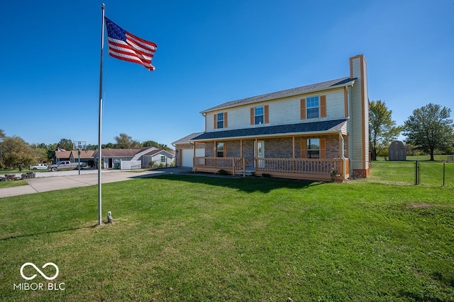 view of front of property featuring a front lawn and covered porch