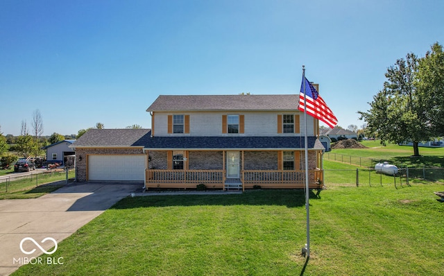 view of front of house featuring a garage and a front lawn