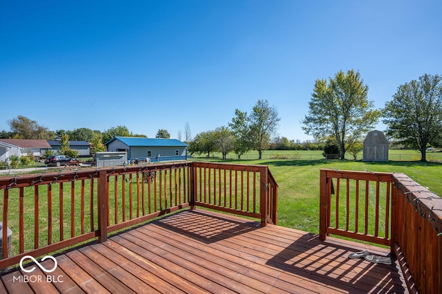 wooden deck featuring a storage shed and a yard