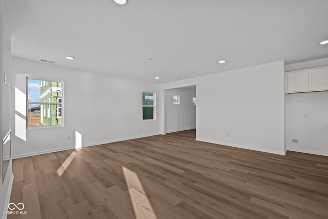 spare room with dark hardwood / wood-style flooring