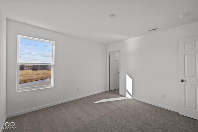 unfurnished room with carpet floors