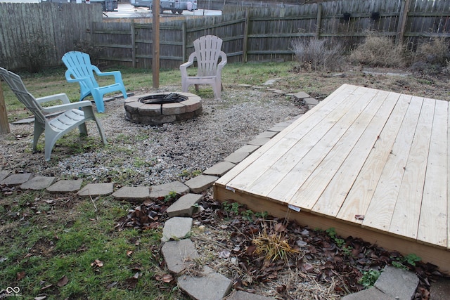 view of yard with a fire pit