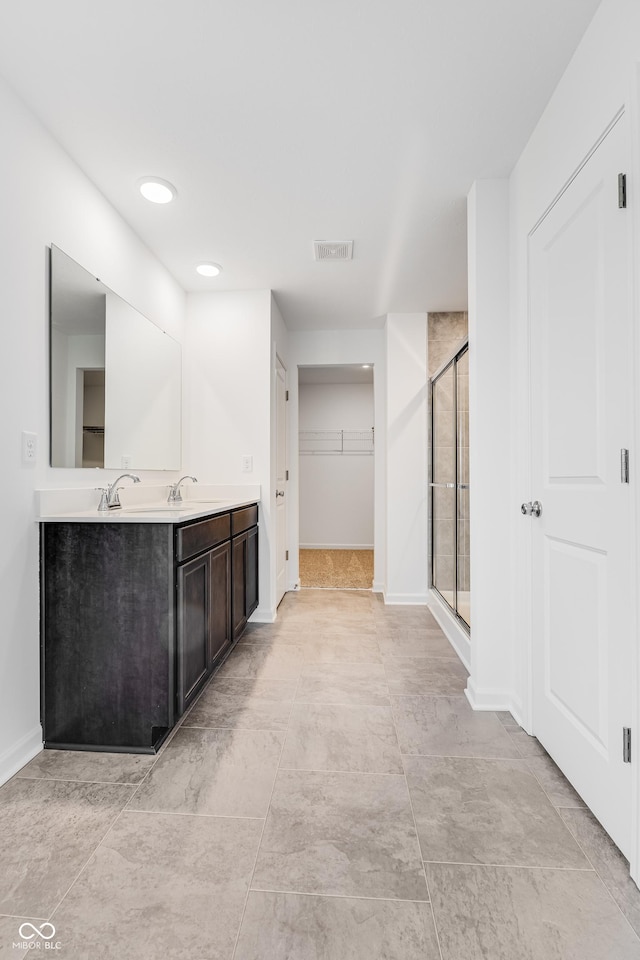 bathroom with vanity and walk in shower