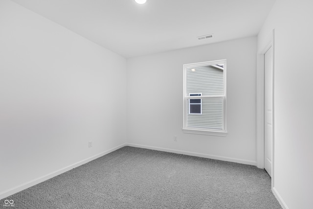 unfurnished room with carpet flooring