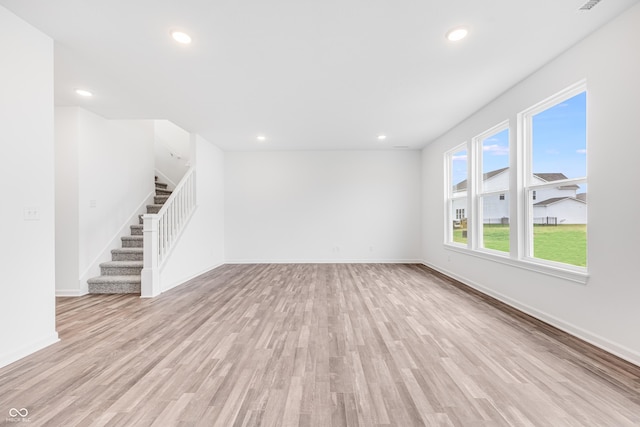 unfurnished living room featuring light hardwood / wood-style flooring