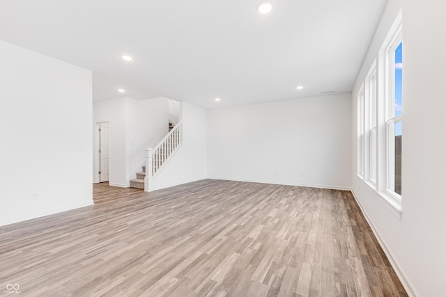 unfurnished living room featuring light hardwood / wood-style floors