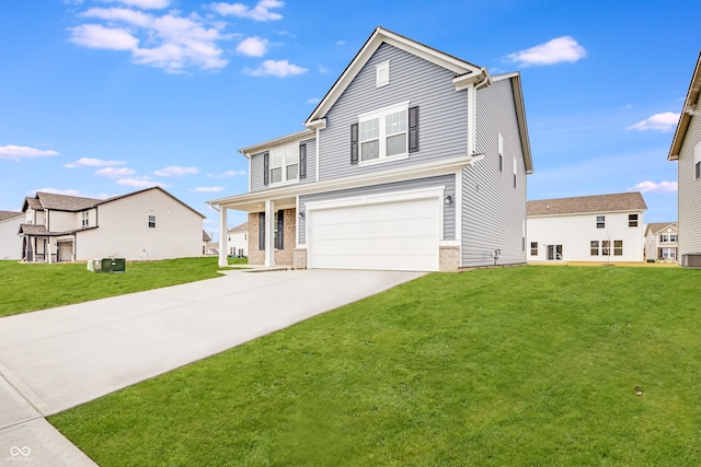 view of property with a front yard and a garage