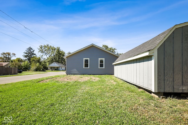 view of property exterior with a yard