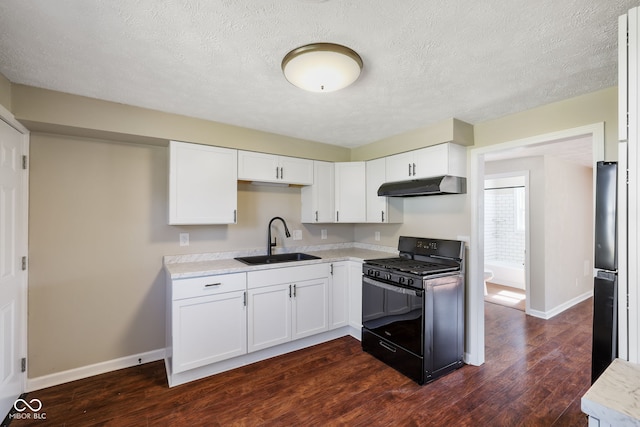 kitchen with dark hardwood / wood-style floors, white cabinets, black appliances, and sink