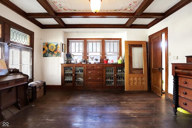 interior space featuring dark wood-type flooring, coffered ceiling, and a wealth of natural light