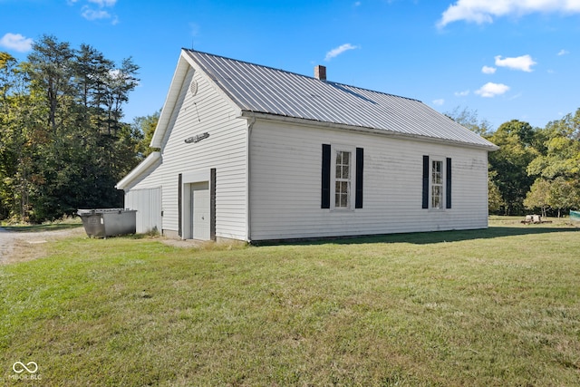 view of side of home featuring a yard