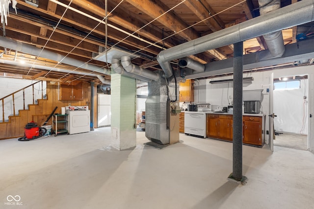 basement with washer / clothes dryer and heating unit