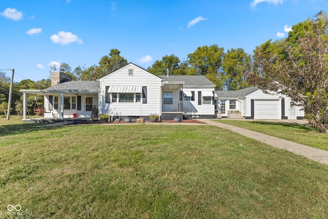 view of front of property featuring a front yard and a garage