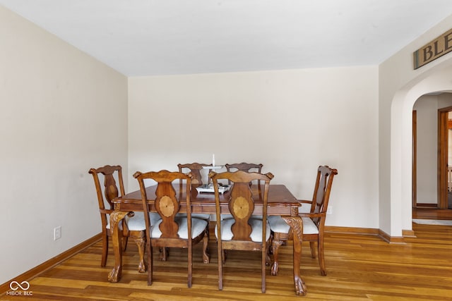 dining room with hardwood / wood-style floors