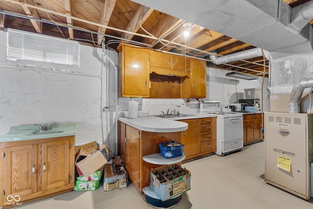 basement with heating unit and sink