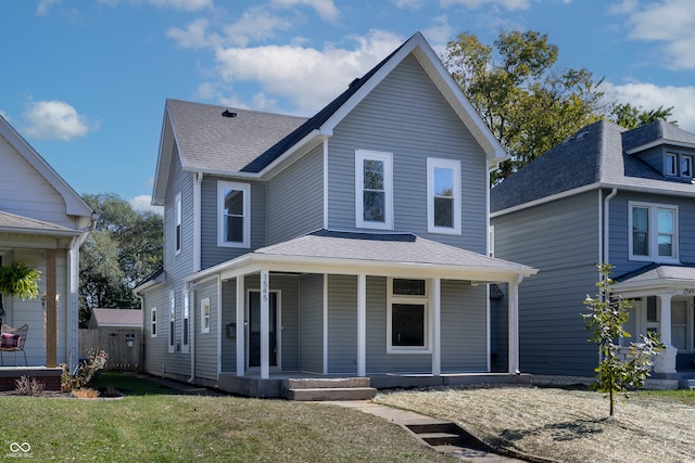 view of front property with covered porch and a front lawn