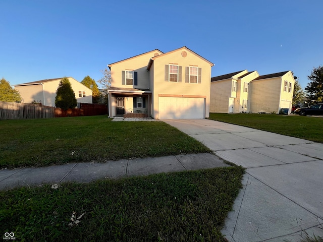 front of property featuring a front yard and a garage