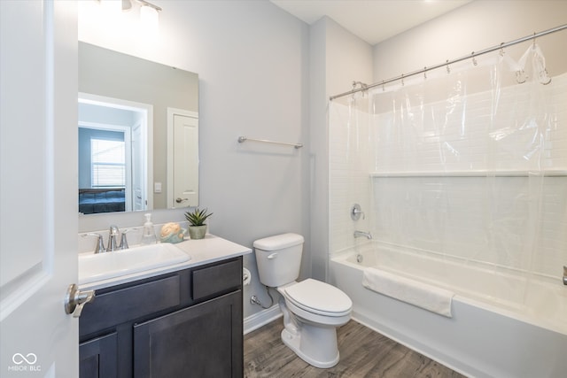 full bathroom featuring wood-type flooring, shower / bathtub combination with curtain, vanity, and toilet