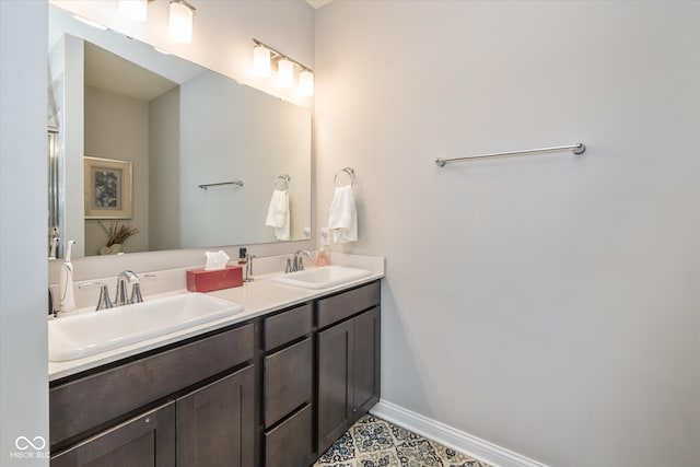 bathroom with vanity and tile patterned flooring