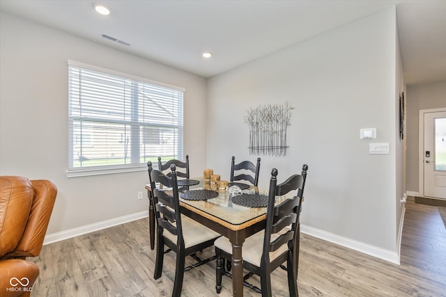 dining room with light hardwood / wood-style floors