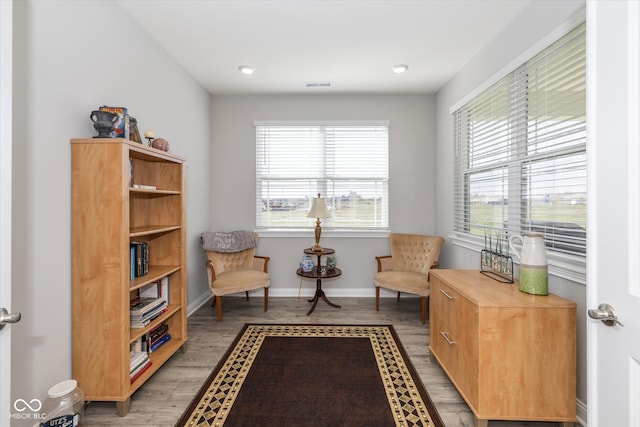 sitting room featuring hardwood / wood-style flooring and a wealth of natural light