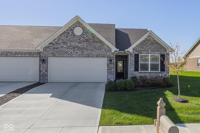 view of front facade with a front yard and a garage