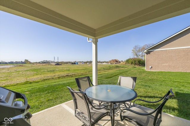 view of patio featuring grilling area and a rural view