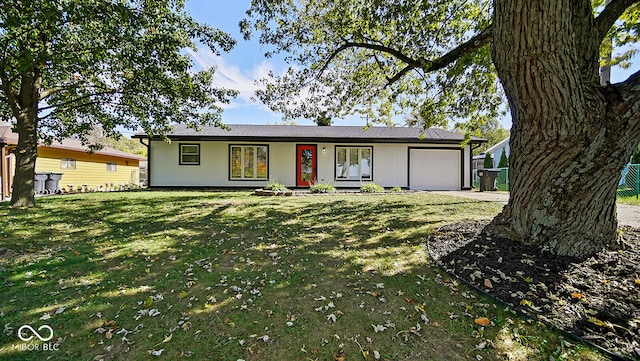 ranch-style home with a front yard and a garage