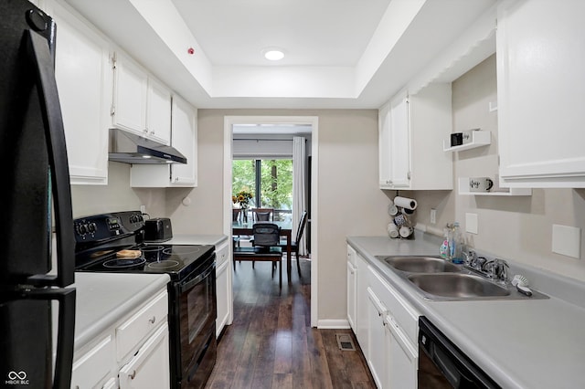 kitchen with black appliances, dark wood-type flooring, sink, and white cabinets