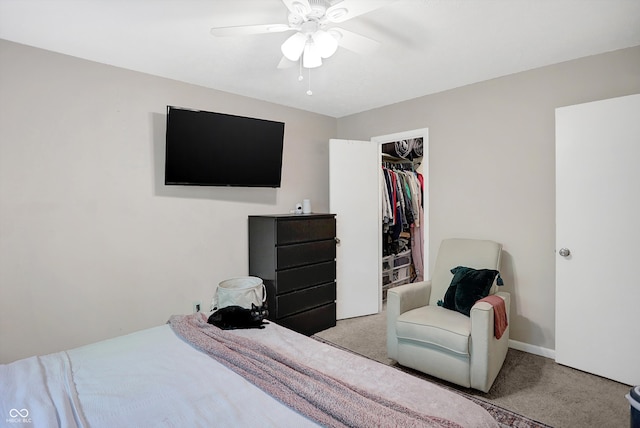 carpeted bedroom featuring a closet and ceiling fan