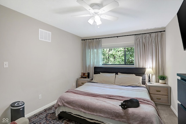 bedroom with ceiling fan and carpet floors