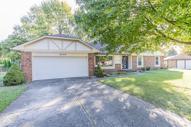 view of front of home with a garage and a front yard