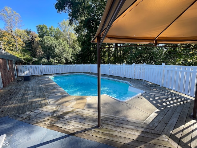 view of swimming pool featuring a deck