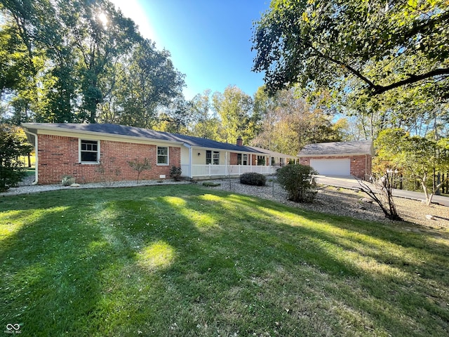 ranch-style home with a front yard and a garage