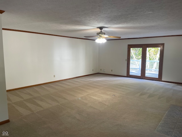 unfurnished room featuring ornamental molding, light carpet, ceiling fan, and a textured ceiling