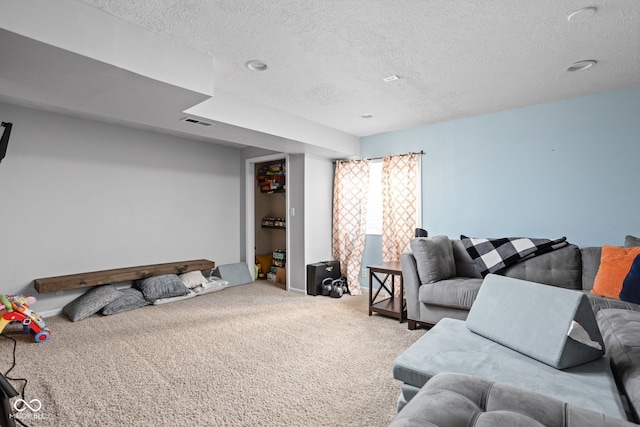 carpeted bedroom featuring a textured ceiling