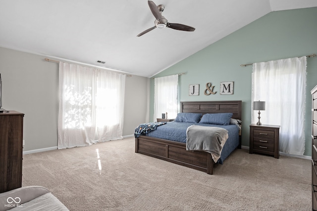 carpeted bedroom featuring ceiling fan and vaulted ceiling